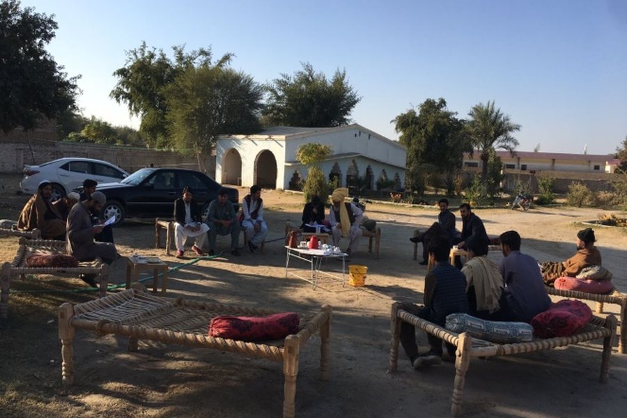 NEST team consulting local community members during a site visit