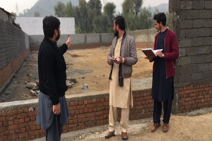 NEST assessors conducting a field survey at a construction site